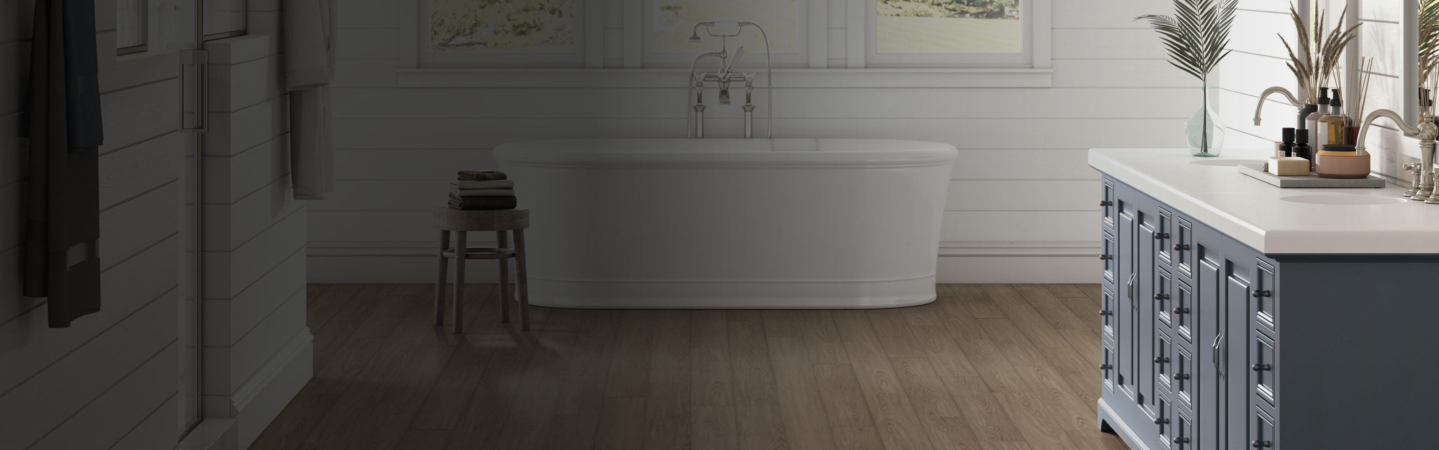 bathtub in bathroom with waterproof floors